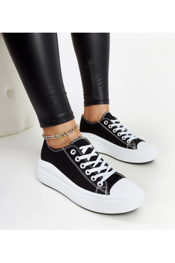 Tênis preto sobre...