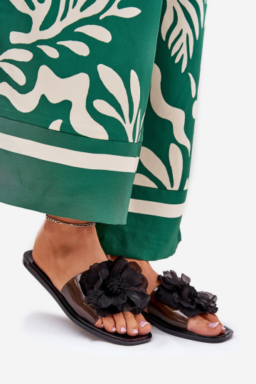 chinelas femininas transparentes de sola plana com flor artificial pretas Vobetta